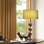 This soft green shade changes the quality of light in the room.