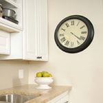 A vintage clock in the kitchen is useful and attractive.