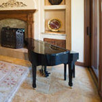 Even a small piano adds drama to a room.