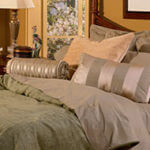 Bedding in a variety of taupe hues creates a sensuous feel.