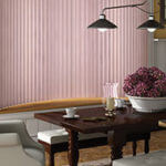Pink window fashions soften the feel of a dining room.