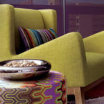 A lively green chair adds interest in a living room.