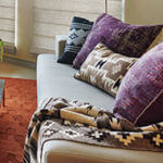 Throws and pillows layered on a sofa create a perfect finishing touch.