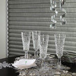 Festive table settings and glassware add an elegant holiday touch.