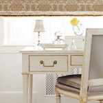 A vintage dressing table adds beauty and function to a bedroom.