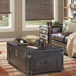An antique chest is repurposed as a coffee table with character.