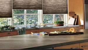 Brown countertops with Hunter Douglas shades