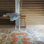 Gentle pastels in this rug help lighten a dark room.