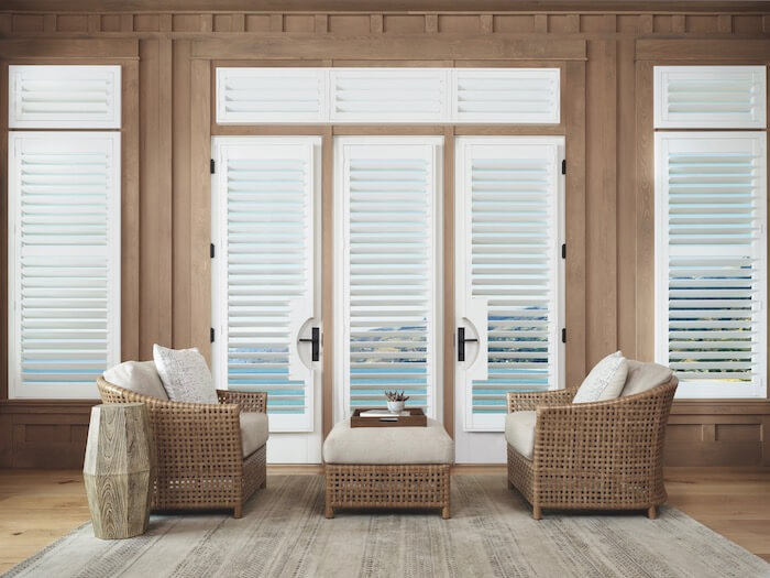 White Palm Beach™ Polysatin™ shutters with dark wood casing create a dramatic effect.