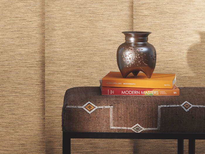 Decorate with books that reflect your interests. Shown with Skyline® Gliding Window Panels.