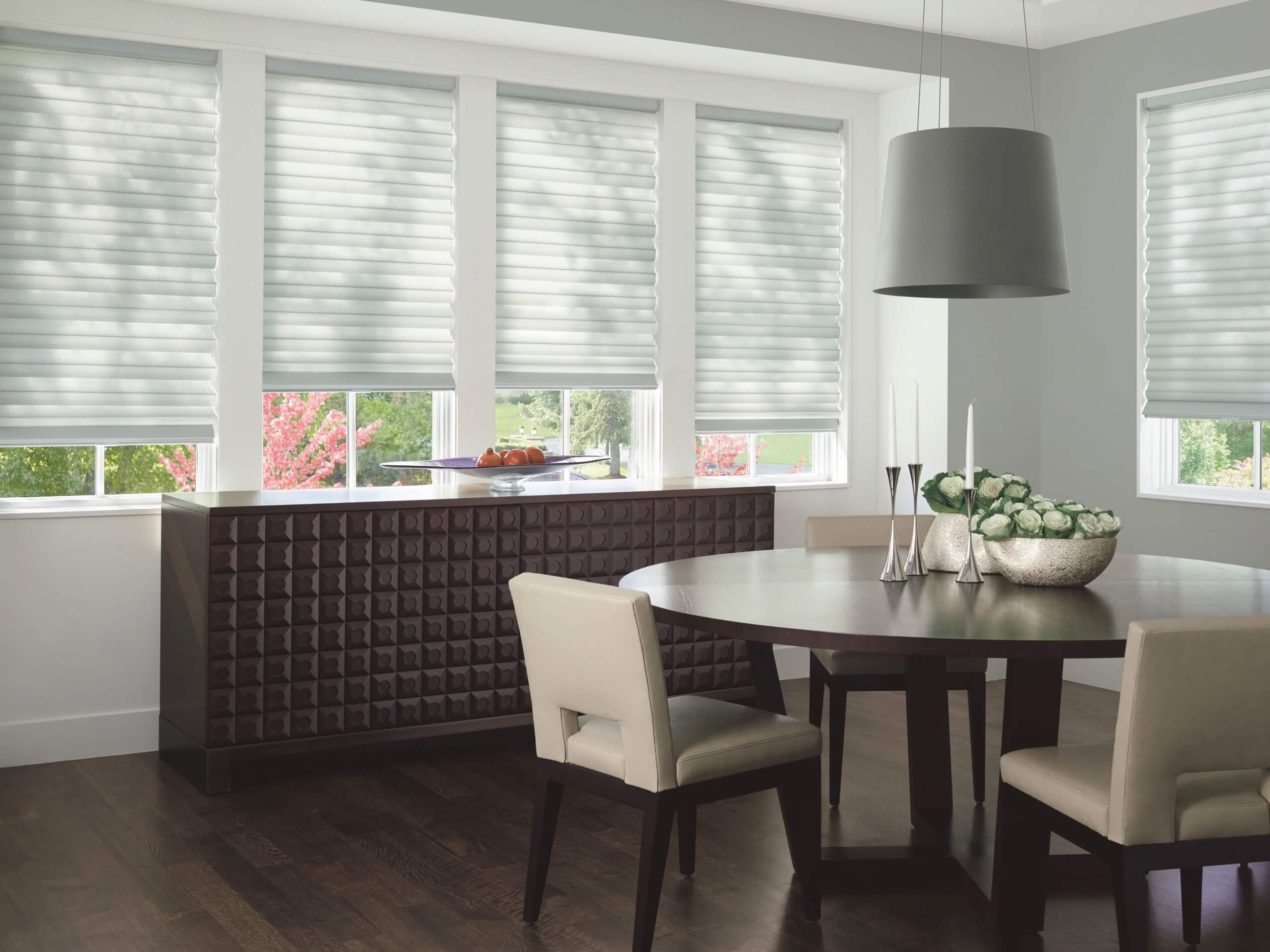 Hide your less-display worthy pieces behind closed doors. Shown with Solera® Soft Shades.