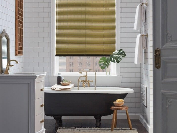 A tray adds function; a plant adds beauty. Shown with Décor® aluminum blinds.