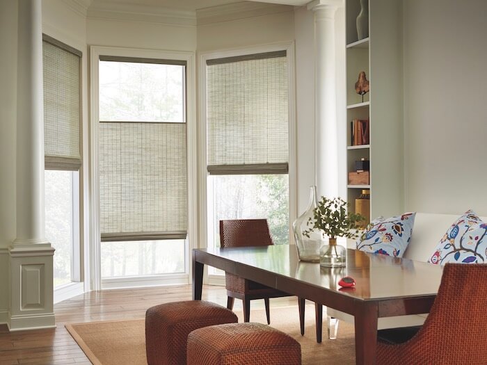 Complementary shades of green and red create a sense of calm. Shown with Provenance® Woven Wood Shades.