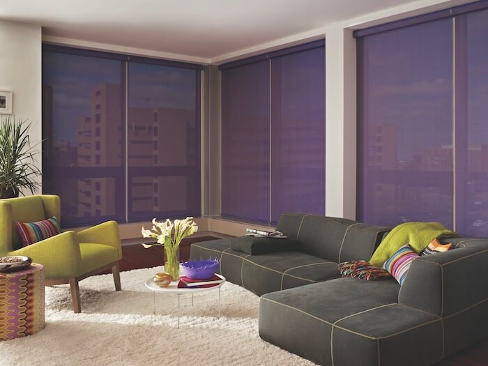 Lime green and purple accents make this room pop. Shown with Designer Screen Shades.