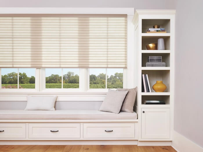 Create extra seating, storage, and display space.  Shown with Sonnette™ Cellular Roller Shades.